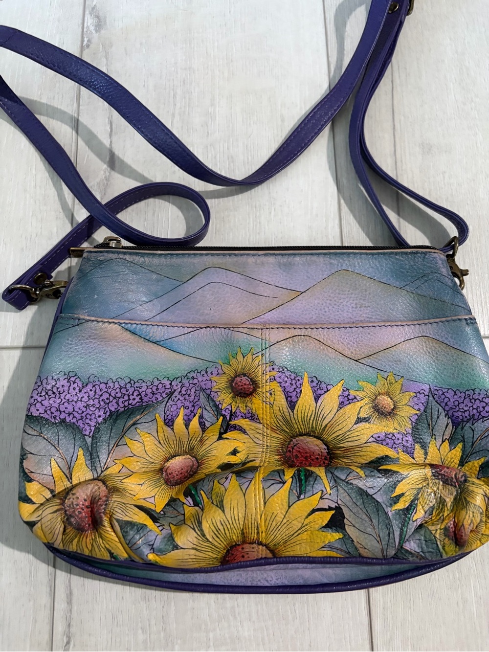 Anna by Anuschka purse with yellow sunflowers and purple background design
